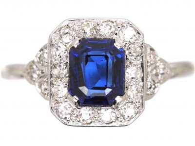 Platinum Diamond Cluster Ring Set With An Emerald Cut Sapphire
