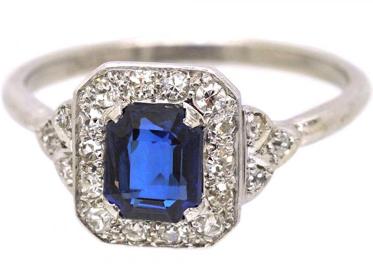 Platinum Diamond Cluster Ring Set With An Emerald Cut Sapphire