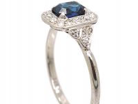 Platinum Diamond Cluster Ring Set With An Emerald Cut Sapphire