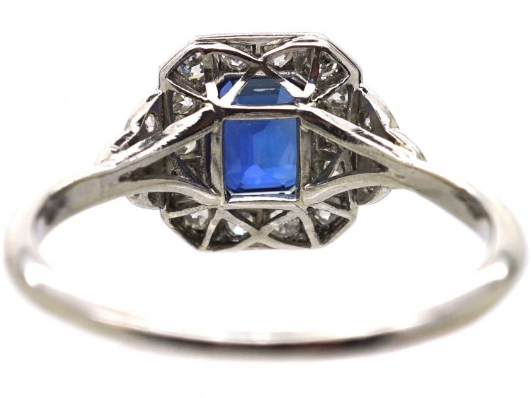 Platinum Diamond Cluster Ring Set With An Emerald Cut Sapphire