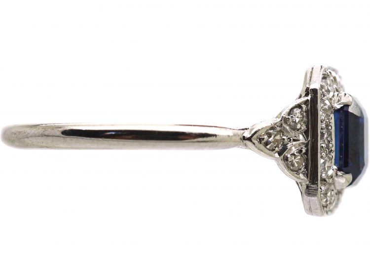 Platinum Diamond Cluster Ring Set With An Emerald Cut Sapphire