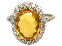 Early 20th Century Platinum Yellow Sapphire & Diamond Oval Cluster Ring