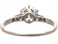 Early 20th Century Platinum, Diamond Solitaire Ring with Diamond Set Shoulders
