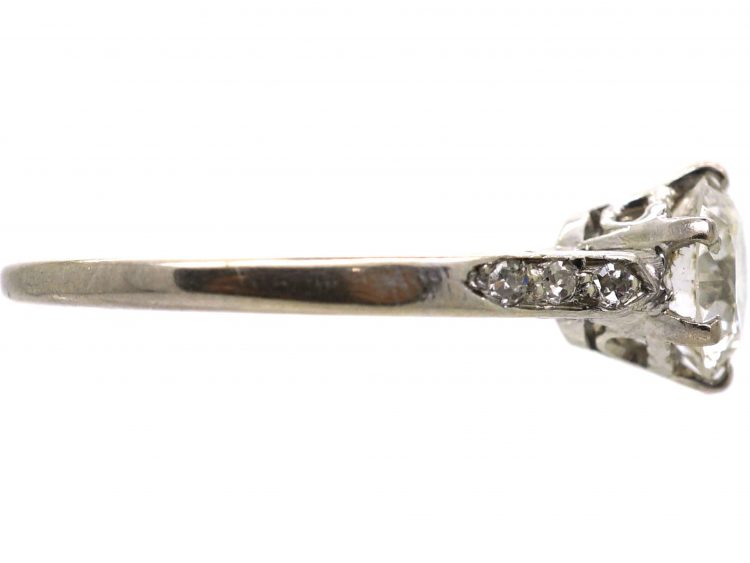 Early 20th Century Platinum, Diamond Solitaire Ring with Diamond Set Shoulders