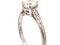 Early 20th Century Platinum, Diamond Solitaire Ring with Diamond Set Shoulders