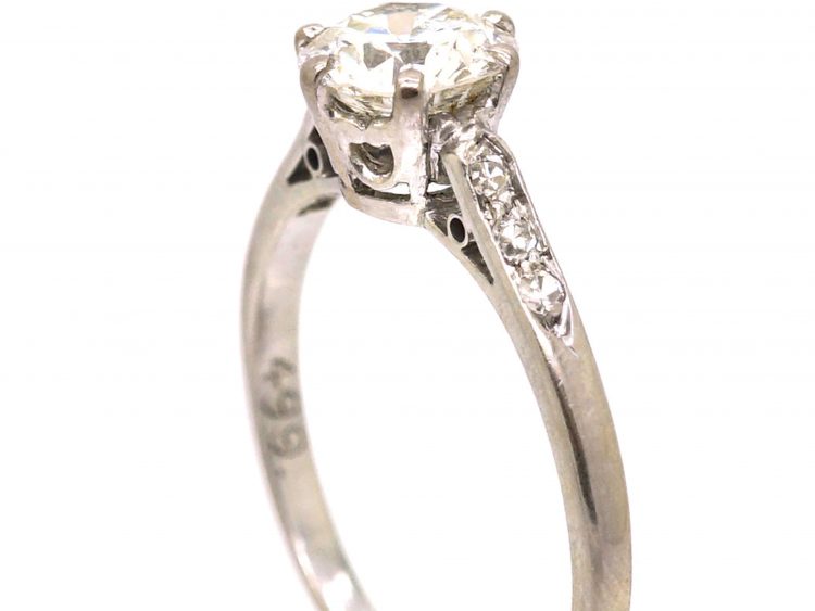 Early 20th Century Platinum, Diamond Solitaire Ring with Diamond Set Shoulders