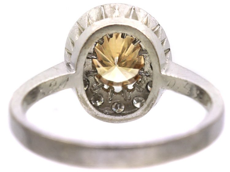 Mid 20th Century 18ct Gold Cluster Ring set with a Cognac Diamond within an Oval Ring of Diamonds
