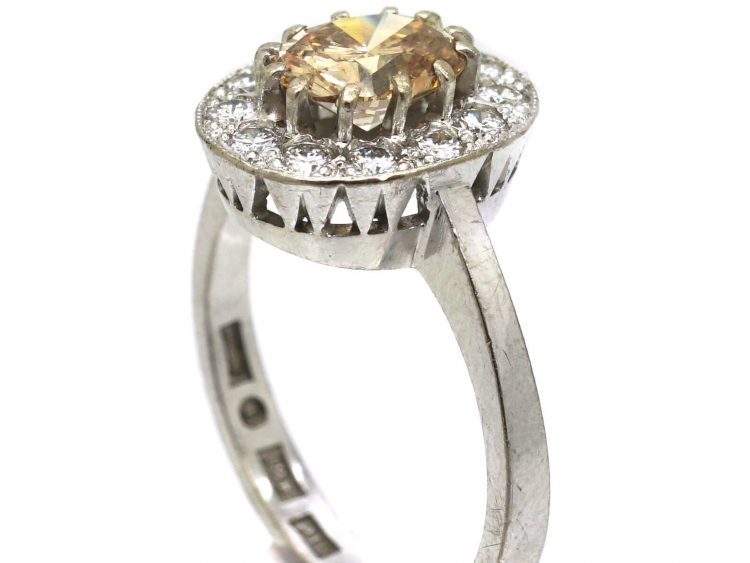 Mid 20th Century 18ct Gold Cluster Ring set with a Cognac Diamond within an Oval Ring of Diamonds