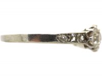 Early 20th Century Platinum, Three Stone Diamond Ring with Diamond set Shoulders