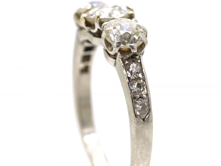 Early 20th Century Platinum, Three Stone Diamond Ring with Diamond set Shoulders