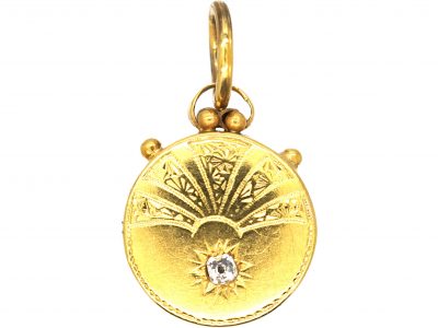 Early 20th Century Sun & Star Round Pendant set with a Diamond