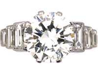Art Deco Platinum, Diamond Solitaire Ring with Step Cut Shoulders set with Baguette Diamonds