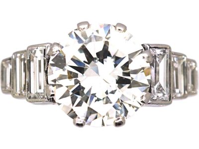 Art Deco Platinum, Diamond Solitaire Ring with Step Cut Shoulders set with Baguette Diamonds