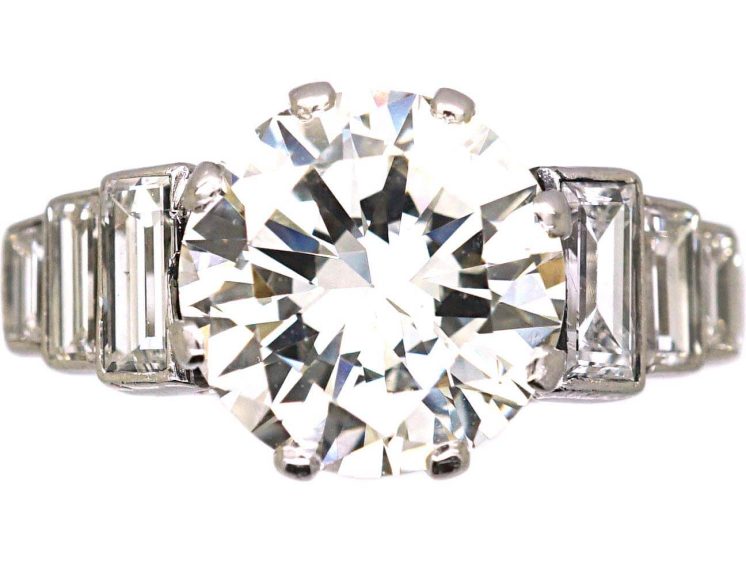 Art Deco Platinum, Diamond Solitaire Ring with Step Cut Shoulders set with Baguette Diamonds