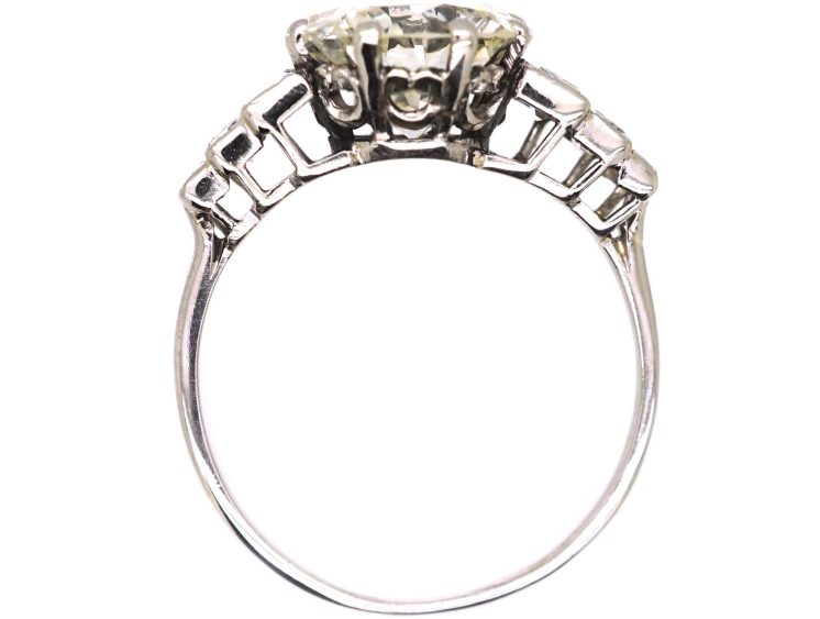Art Deco Platinum, Diamond Solitaire Ring with Step Cut Shoulders set with Baguette Diamonds
