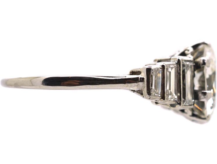 Art Deco Platinum, Diamond Solitaire Ring with Step Cut Shoulders set with Baguette Diamonds