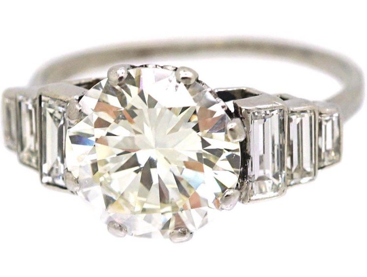 Art Deco Platinum, Diamond Solitaire Ring with Step Cut Shoulders set with Baguette Diamonds
