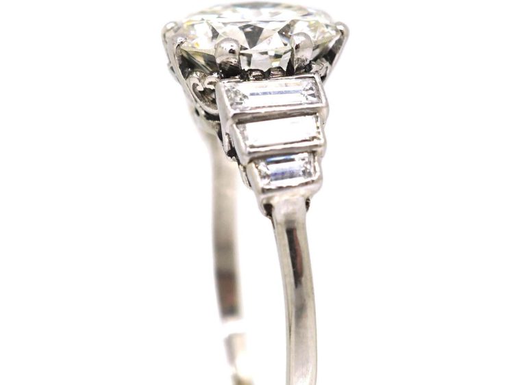 Art Deco Platinum, Diamond Solitaire Ring with Step Cut Shoulders set with Baguette Diamonds
