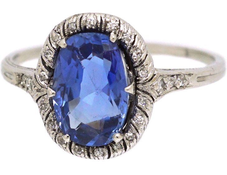Art Deco Platinum Ring set with an Oval Sapphire & Small Diamonds