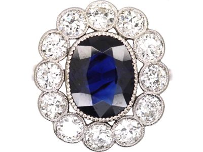 Early 20th Century Platinum, Large Sapphire & Diamond Oval Cluster Ring