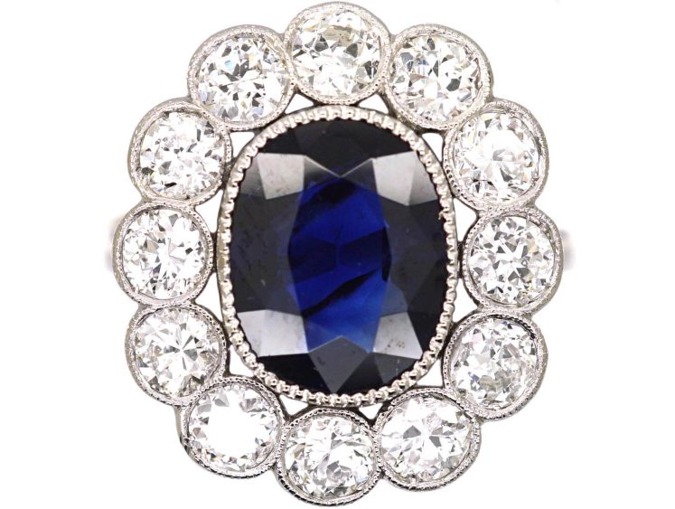 Early 20th Century Platinum, Large Sapphire & Diamond Oval Cluster Ring