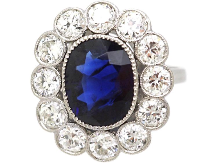Early 20th Century Platinum, Large Sapphire & Diamond Oval Cluster Ring