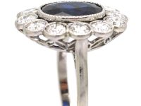 Early 20th Century Platinum, Large Sapphire & Diamond Oval Cluster Ring