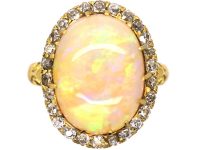Edwardian 18ct Gold Ring set with a Large Cabochon Opal surrounded by Diamonds