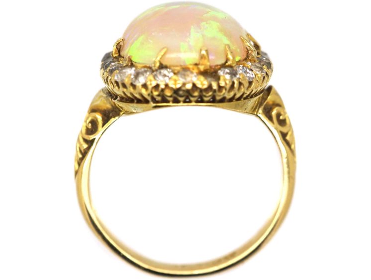 Edwardian 18ct Gold Ring set with a Large Cabochon Opal surrounded by Diamonds