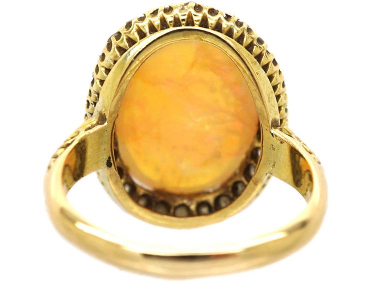 Edwardian 18ct Gold Ring set with a Large Cabochon Opal surrounded by Diamonds