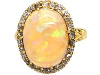 Edwardian 18ct Gold Ring set with a Large Cabochon Opal surrounded by Diamonds