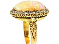 Edwardian 18ct Gold Ring set with a Large Cabochon Opal surrounded by Diamonds