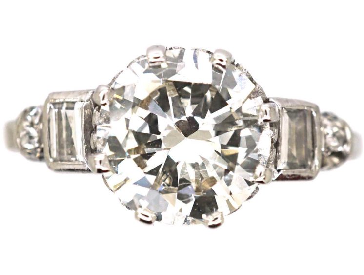 Art Deco Platinum Diamond Solitaire Ring with Baguette Cut Diamond Step Cut Shoulders