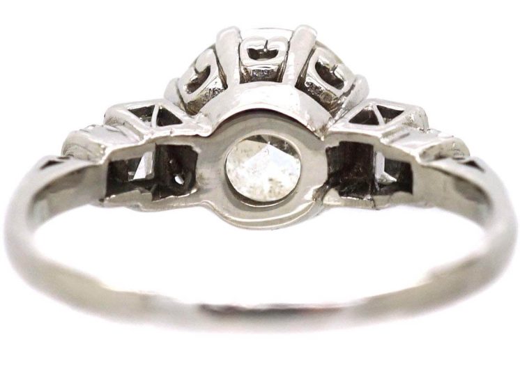 Art Deco Platinum Diamond Solitaire Ring with Baguette Cut Diamond Step Cut Shoulders