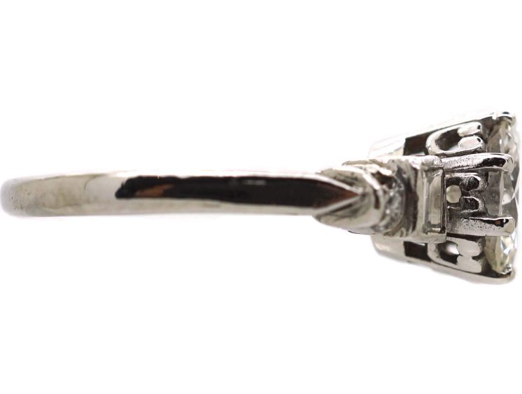 Art Deco Platinum Diamond Solitaire Ring with Baguette Cut Diamond Step Cut Shoulders