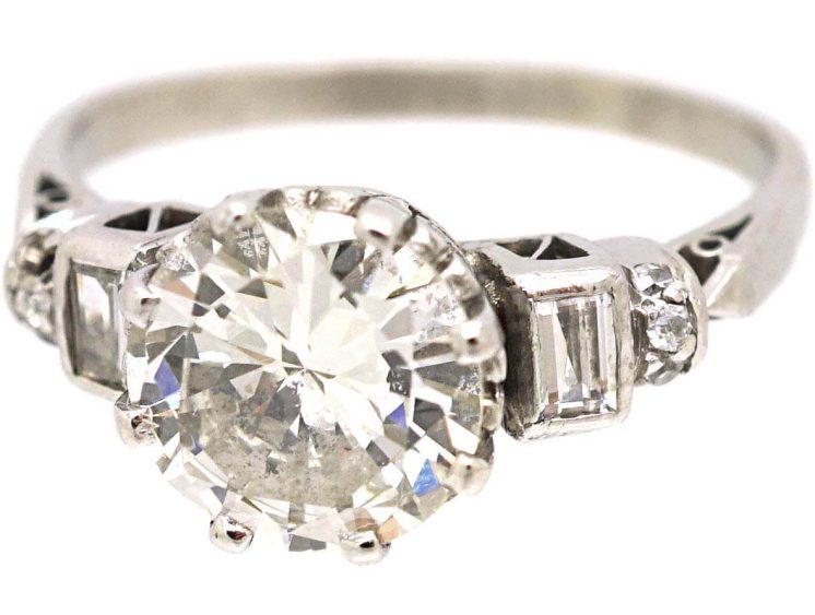 Art Deco Platinum Diamond Solitaire Ring with Baguette Cut Diamond Step Cut Shoulders