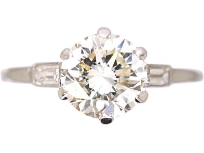 Platinum Solitaire Diamond Ring with Baguette Diamond Shoulders