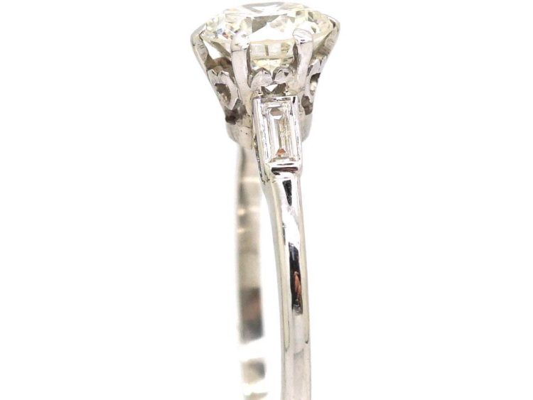 Platinum Solitaire Diamond Ring with Baguette Diamond Shoulders