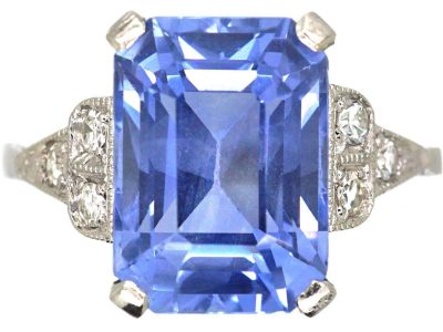 Art Deco Platinum Rectangular Cut Sapphire Ring with Step Cut Diamond Shoulders