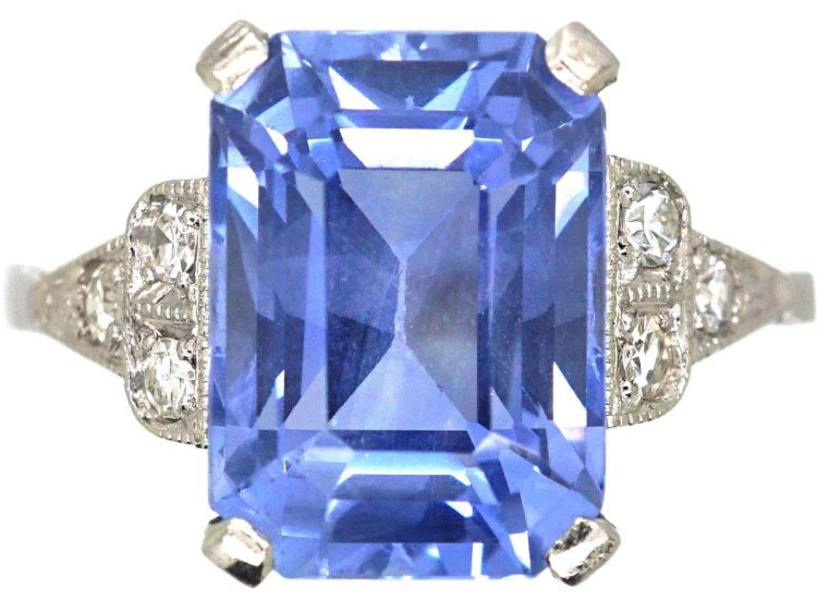 Art Deco Platinum Rectangular Cut Sapphire Ring with Step Cut Diamond Shoulders