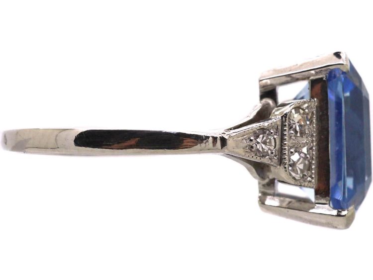 Art Deco Platinum Rectangular Cut Sapphire Ring with Step Cut Diamond Shoulders