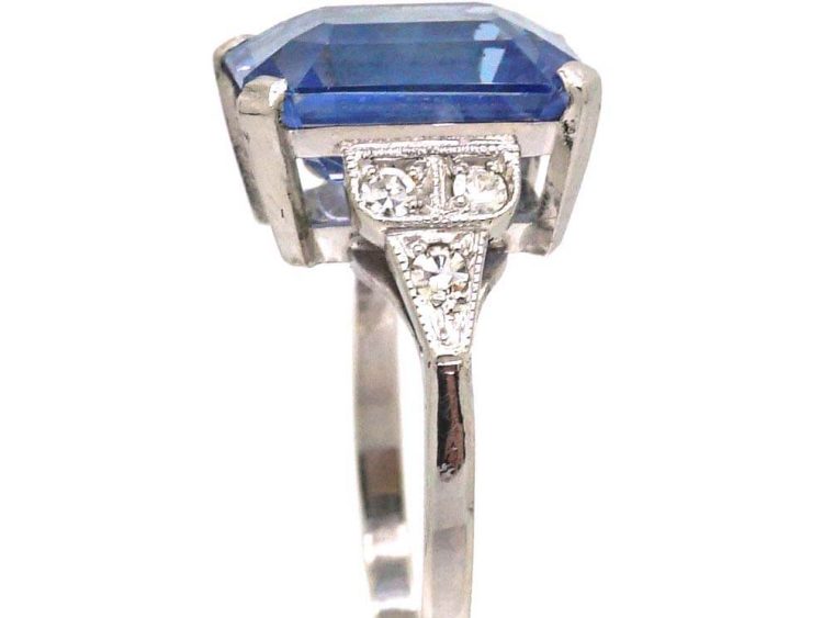 Art Deco Platinum Rectangular Cut Sapphire Ring with Step Cut Diamond Shoulders