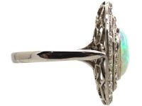 Early 20th Century Large Platinum Cluster Ring set with an Opal & Diamonds