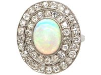 Early 20th Century Large Platinum Cluster Ring set with an Opal & Diamonds