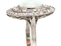 Early 20th Century Large Platinum Cluster Ring set with an Opal & Diamonds
