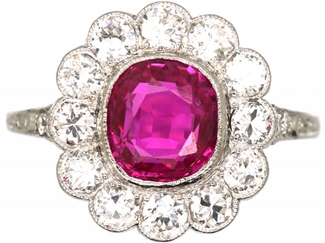Early 20th Century Platinum, Burma Ruby & Diamond Cluster Ring with Diamond Set Shoulders