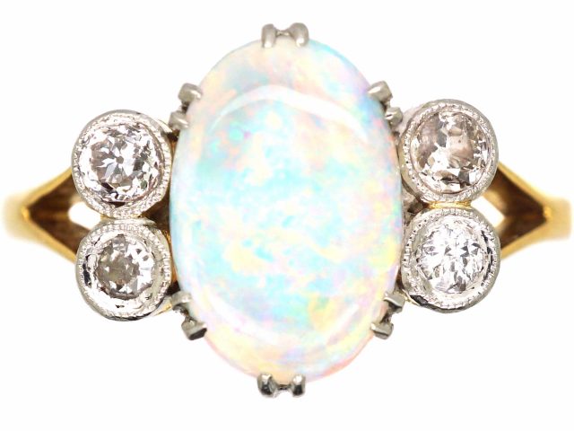 Edwardian 18ct Gold & Platinum Ring set with an Opal with Diamonds on Either Side